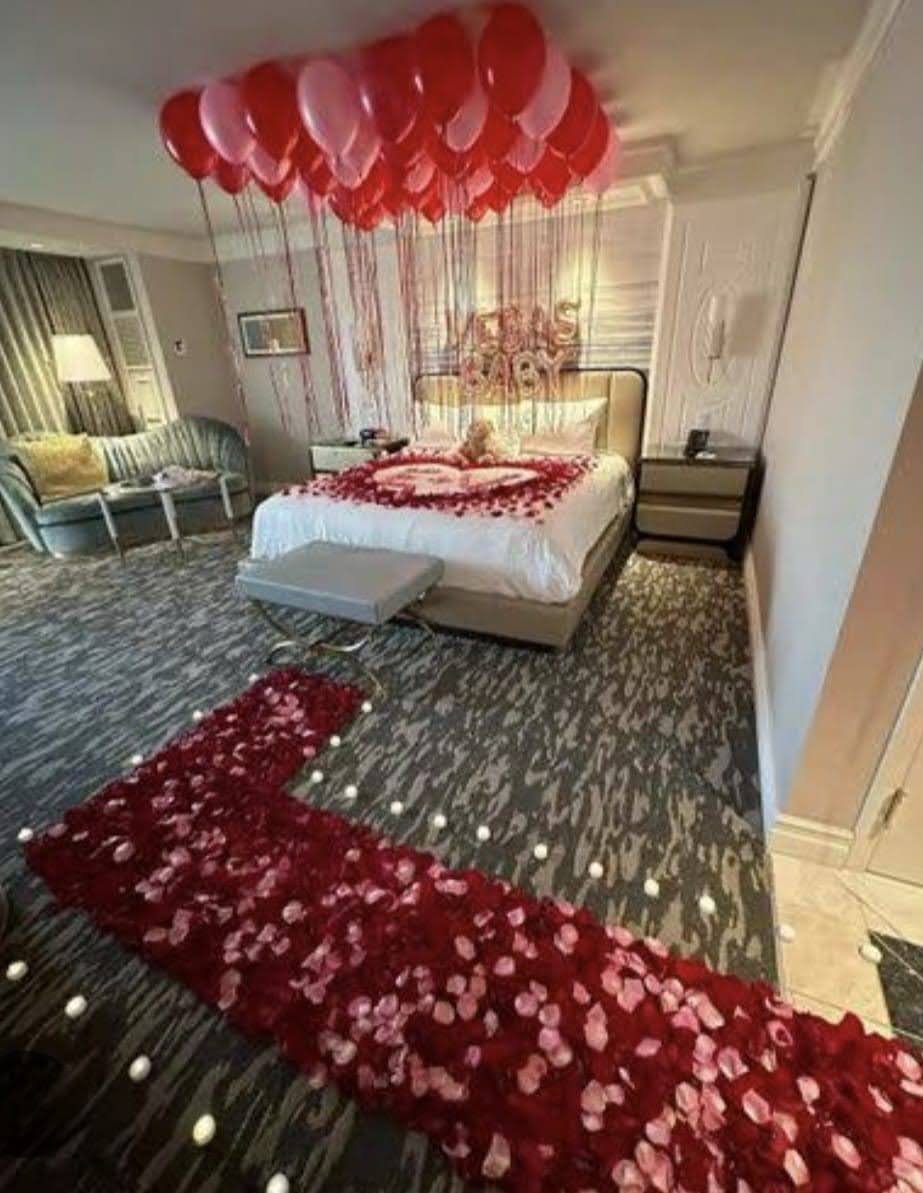  red rose decor with candle for anniversary in gurgaon